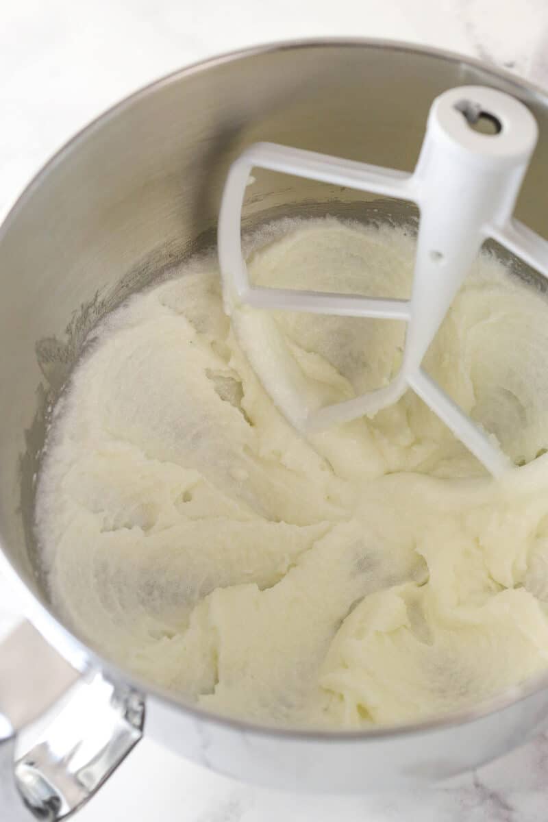 Creaming together butter, oil, and sugar.