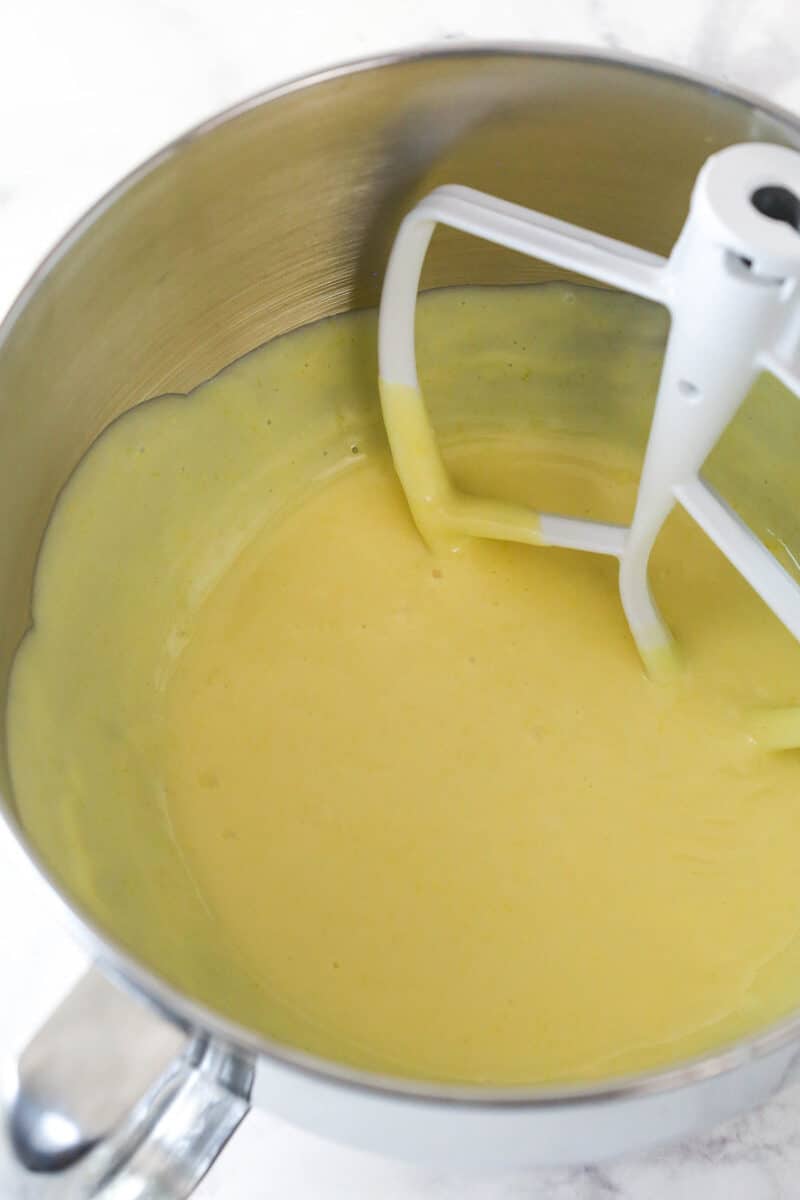 This lemon tart is made up of graham cracker crust, a sweet and tangy, creamy lemon filling, and a fluffy whipped cream topping. Mixing lemon juice and sweetened condensed milk into egg yolks and lemon zest beaten to light and fluffy.