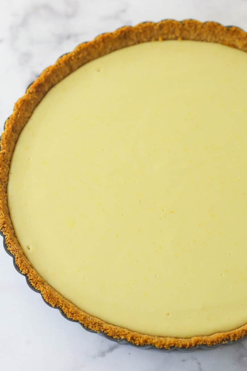 Lemon tart baked and set in a graham cracker crust.