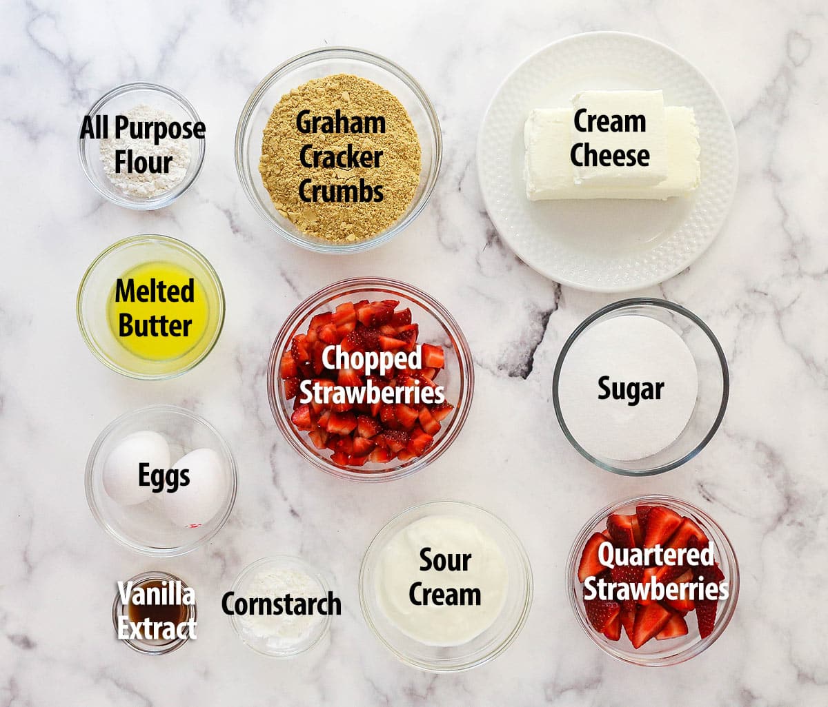 Mini strawberry cheesecakes are made of graham cracker crusts, thick, creamy vanilla cheesecake filling, and sweet strawberry sauce. Ingredients for mini strawberry cheesecakes.