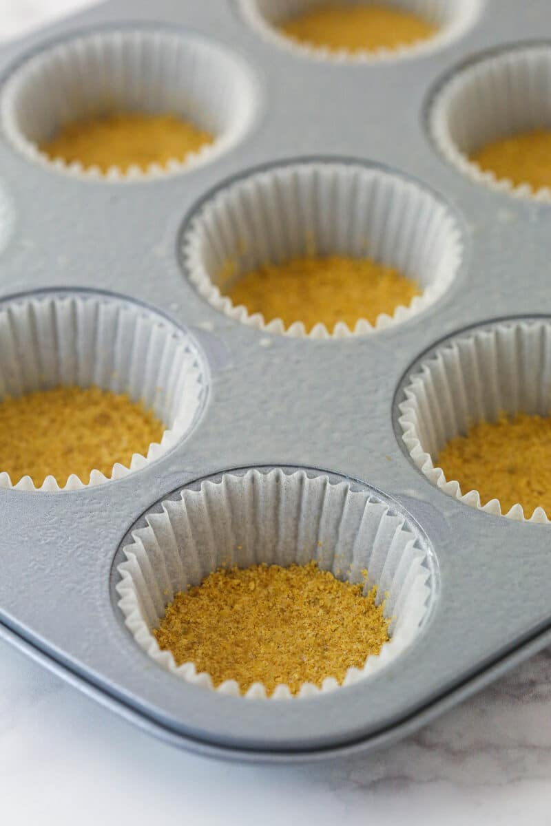 Cupcake liners with graham cracker crust pressed into the bottoms.