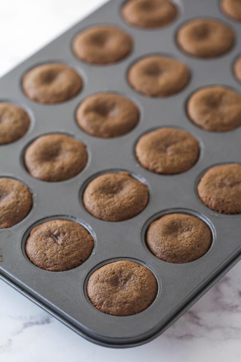baked cookie cups in mini cupcake pan after baking