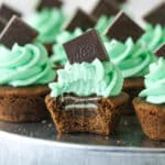 mint chocolate cookie cup with a bite taken out of it so you can see the mint in the middle