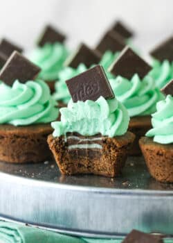 mint chocolate cookie cup with a bite taken out of it so you can see the mint in the middle