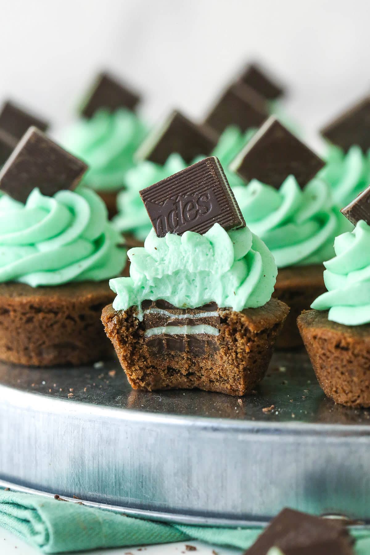 mint chocolate cookie cup with a bite taken out of it so you can see the mint in the middle