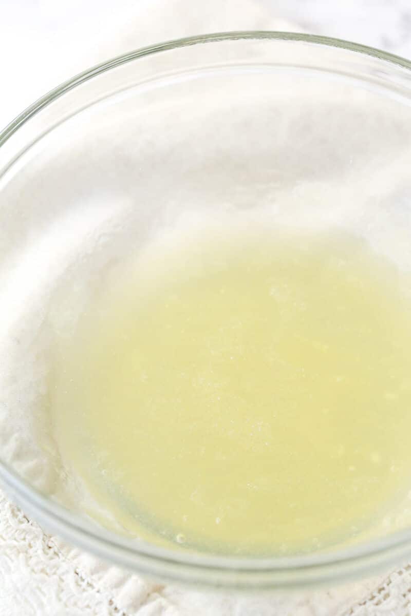 Blooming gelatin in lemon juice.