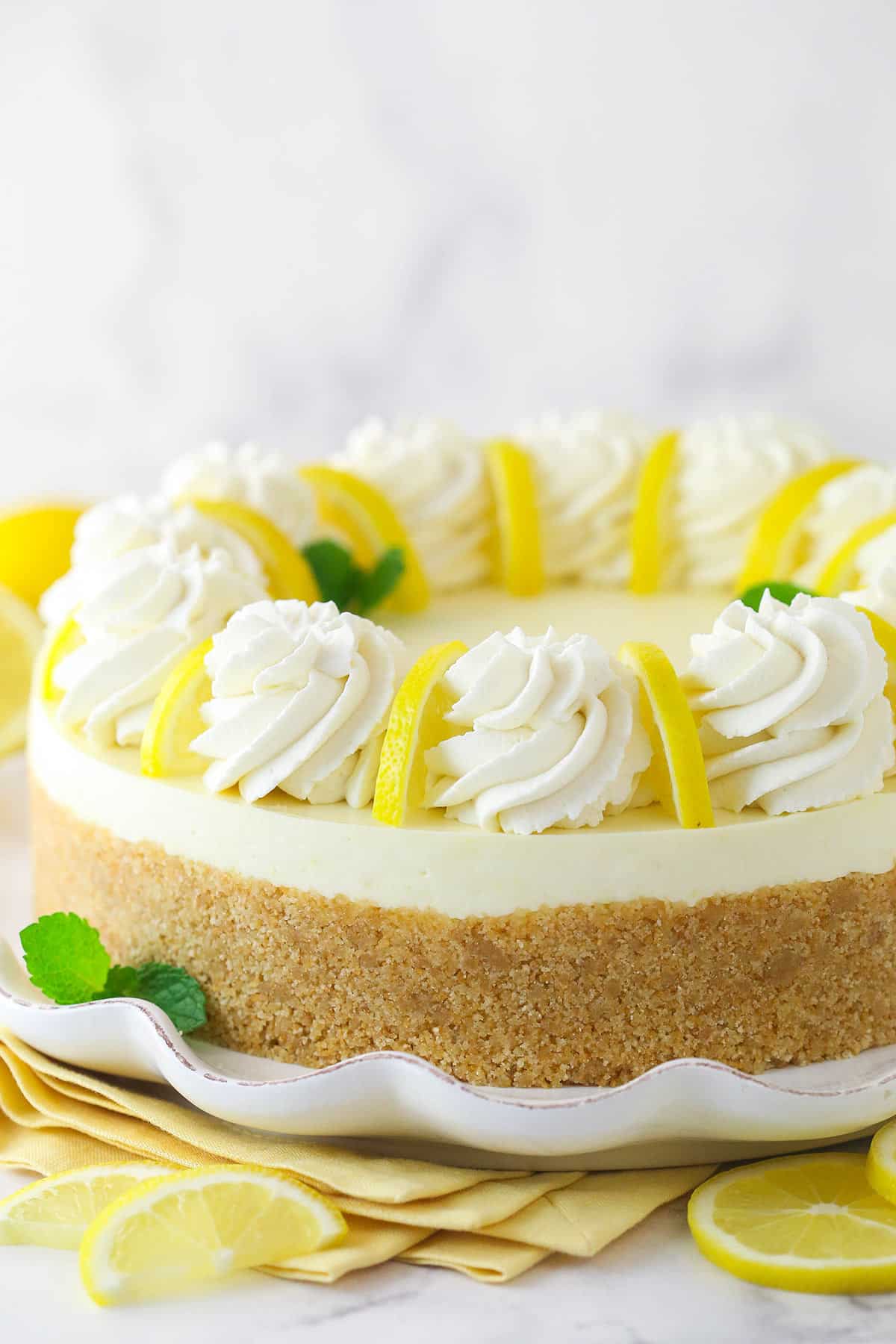 No bake lemon cheesecake on a serving platter.