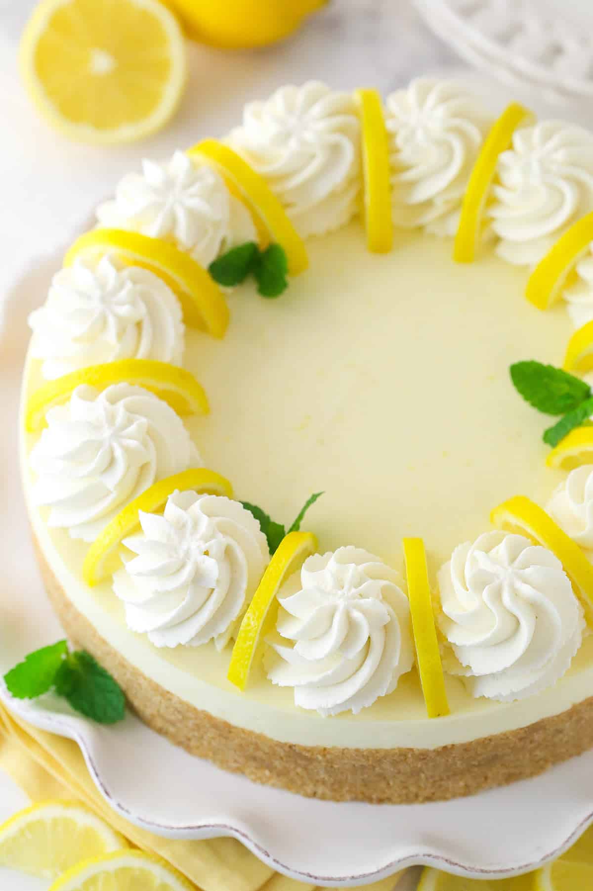 Overhead image of no bake lemon cheesecake on a serving platter.