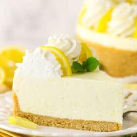 Side view of a slice of no bake lemon cheesecake on a plate.