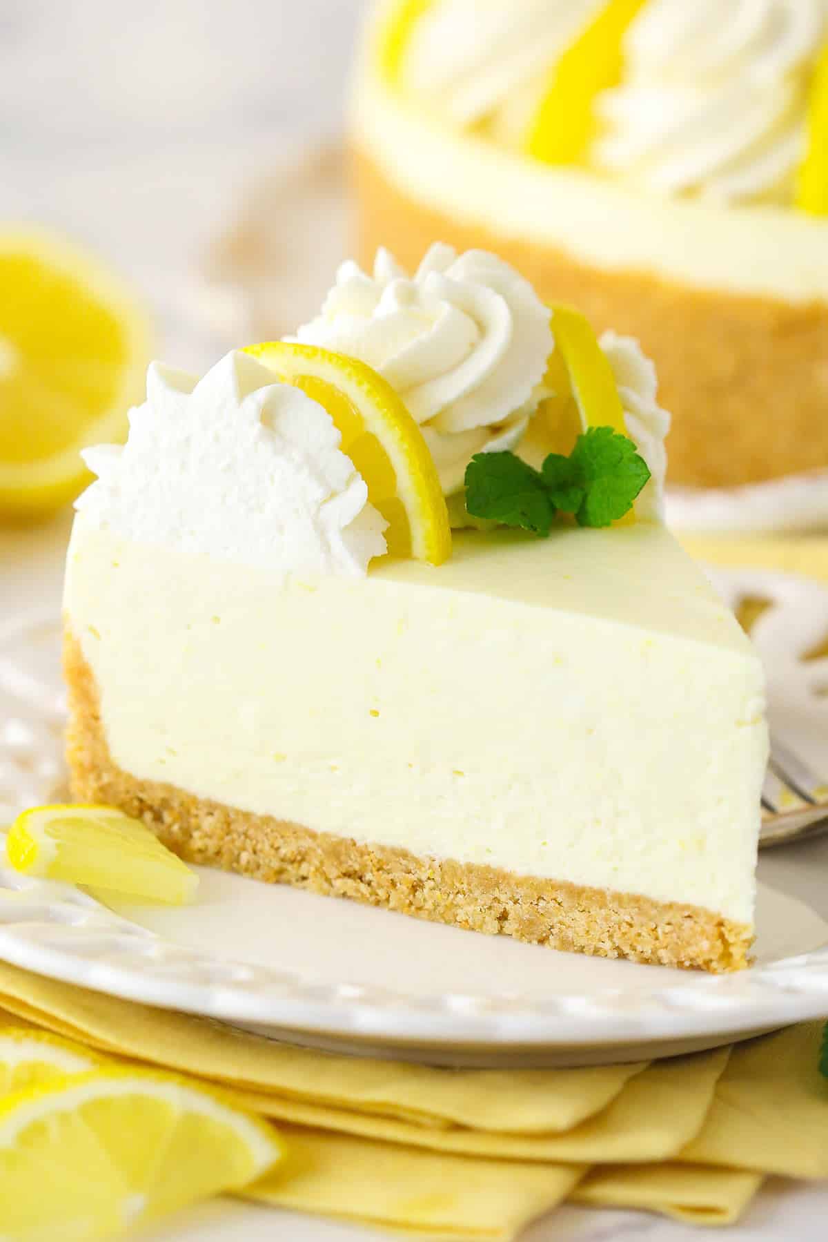 A slice of no bake lemon cheesecake on a plate.