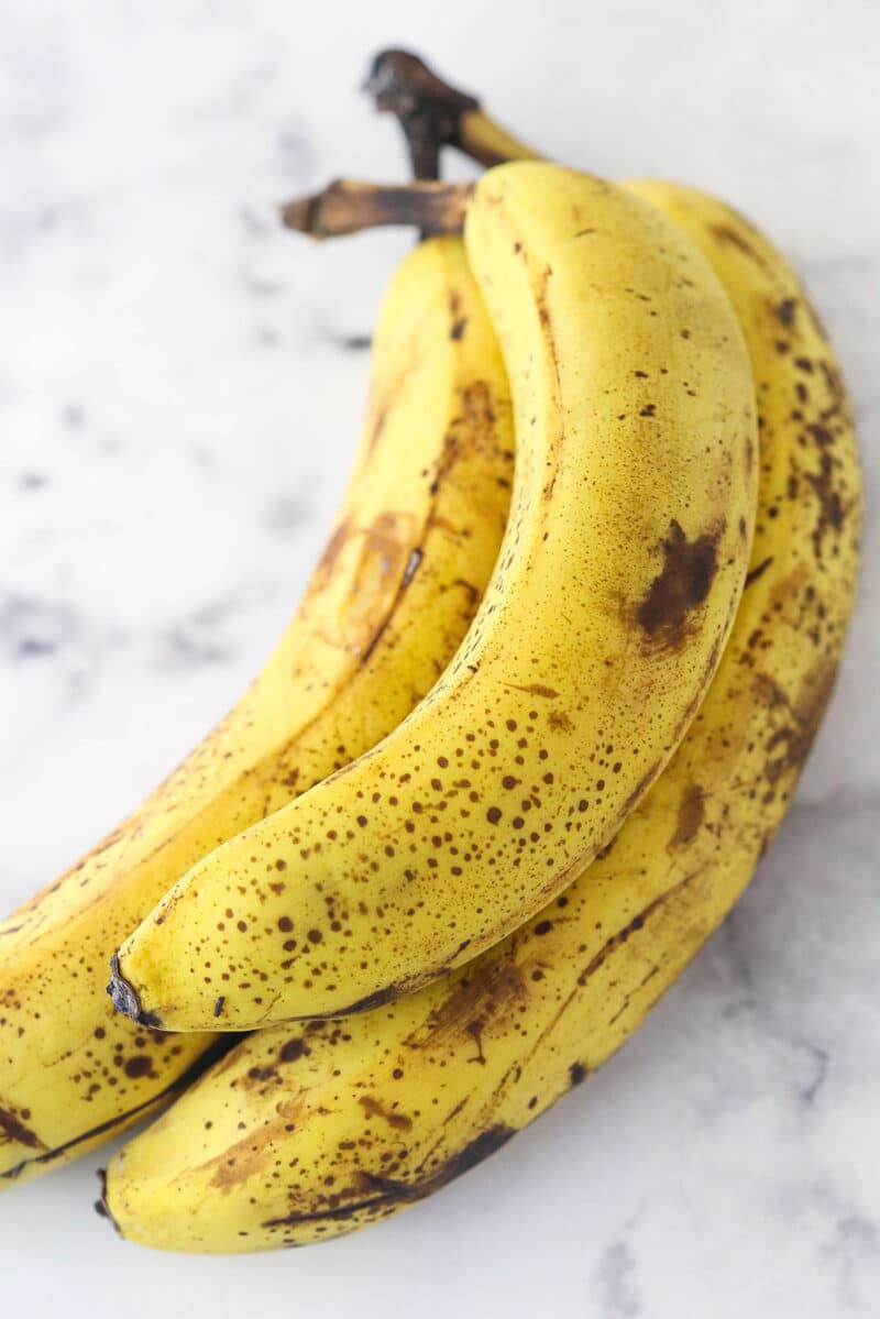 3 overripe bananas on a countertop.