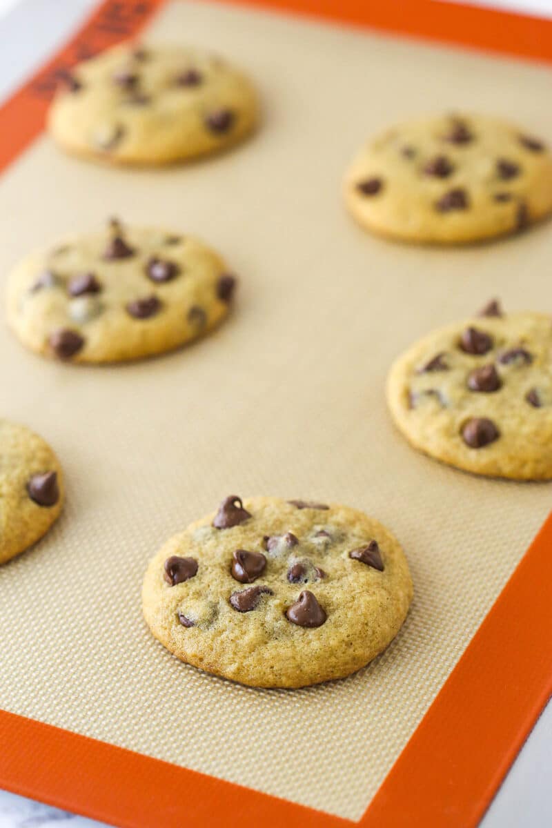Banana chocolate chip cookies on a silicon baking mat.