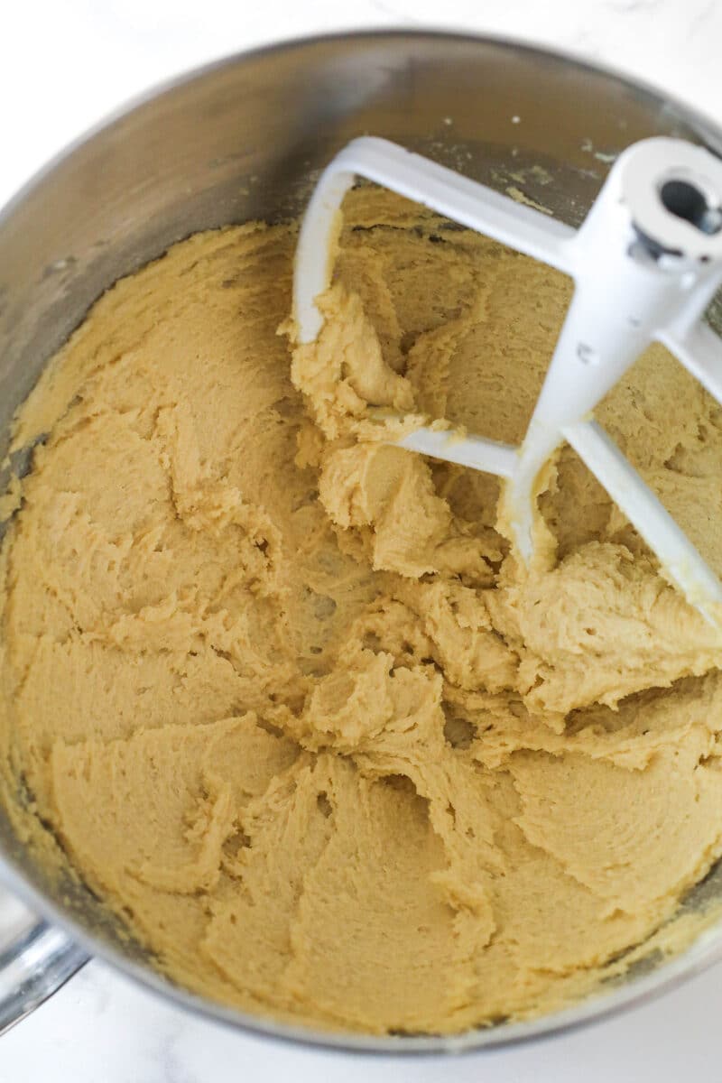 Creaming together butter and sugars for oatmeal cookie dough.