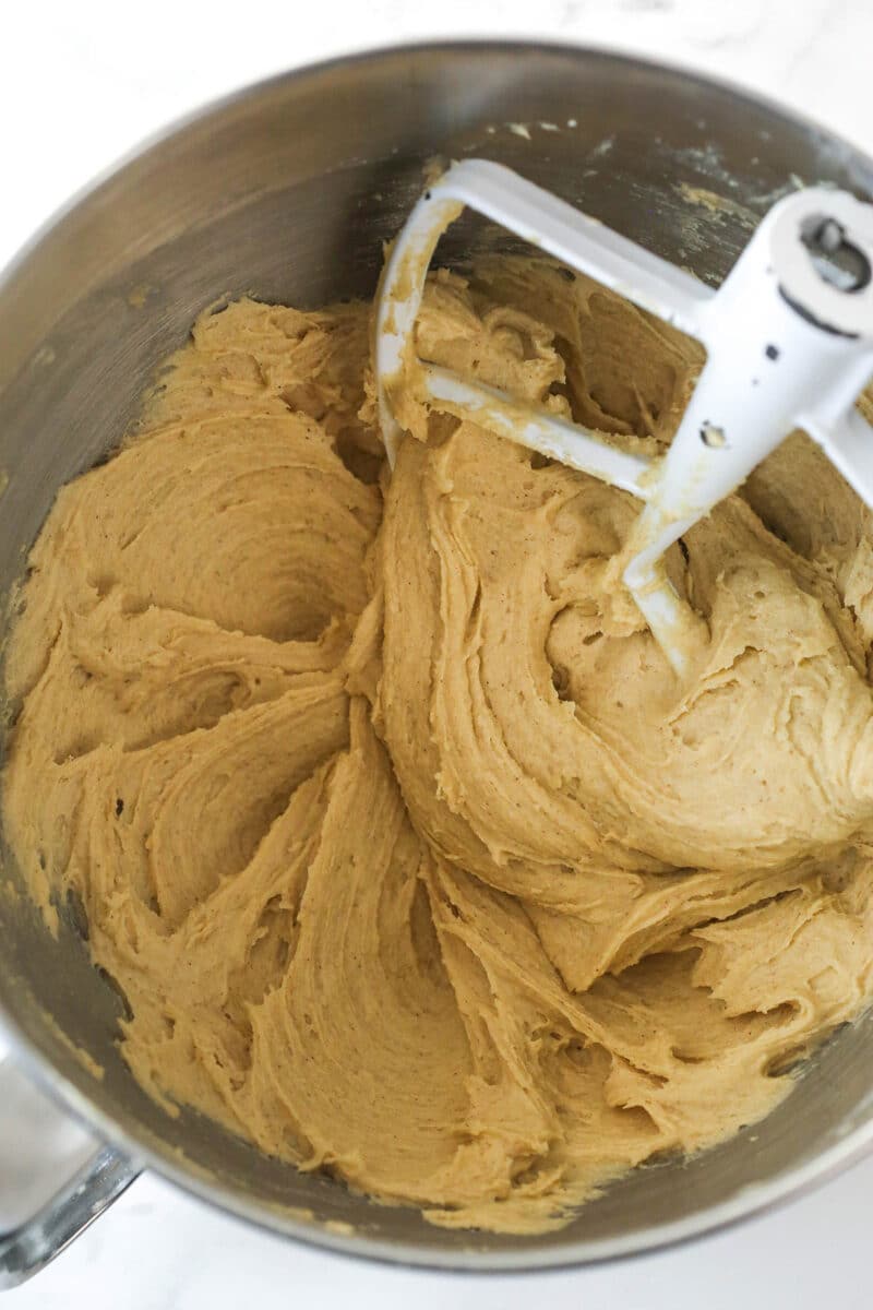 Combining the wet and dry ingredients for oatmeal cookie dough.