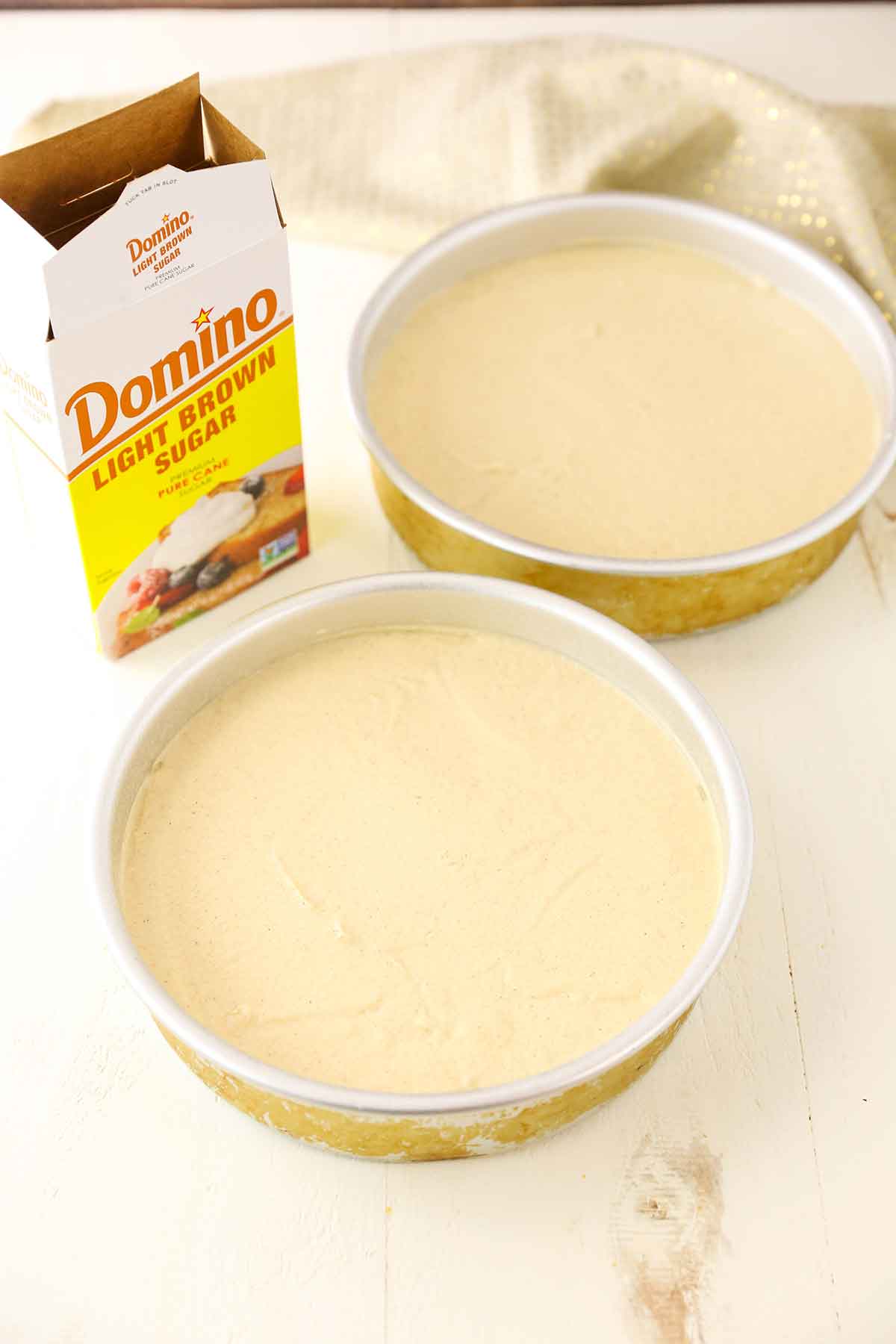Unbaked cake batter in cake pans 