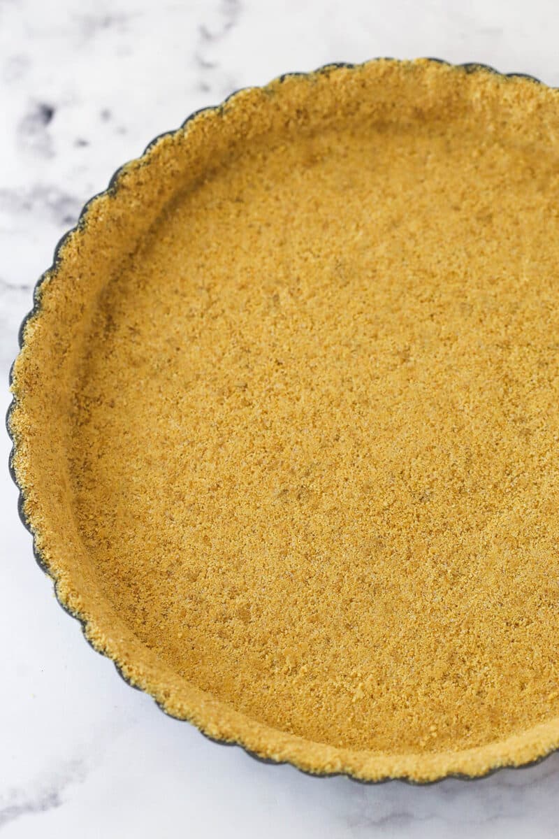 With a hint of cinnamon and some mini chocolate chips, this cannoli tart has all the great flavors of a cannoli wrapped into one simple tart. Graham cracker crust pressed into a tart pan.