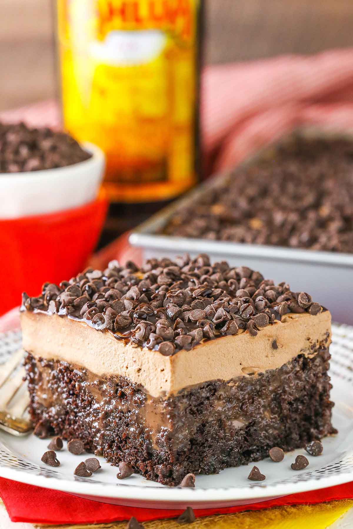 A square slice of Kahlua Chocolate Poke Cake on a white plate
