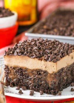 A square slice of Kahlua Chocolate Poke Cake on a white plate