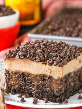A square slice of Kahlua Chocolate Poke Cake on a white plate