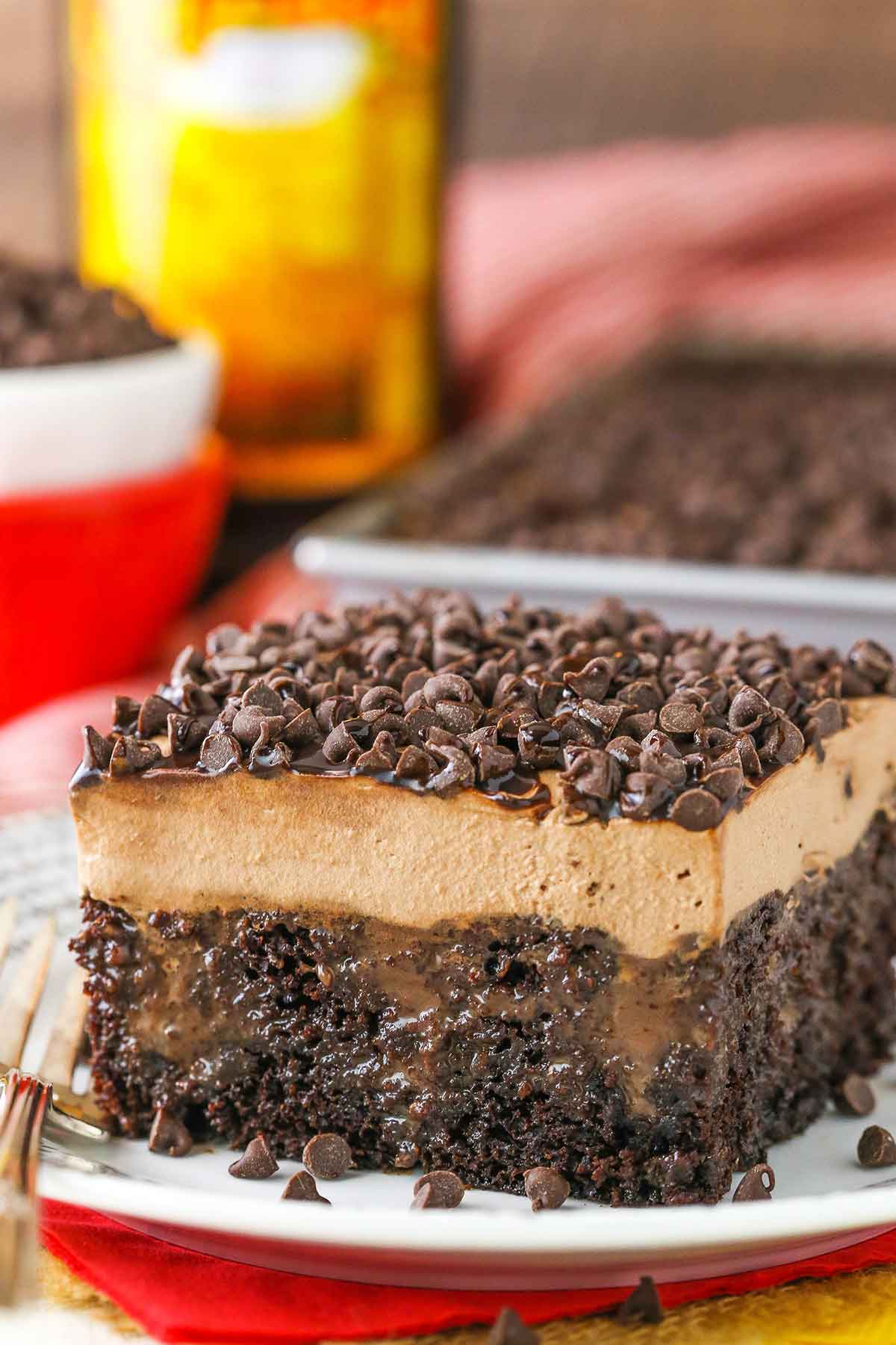 A square slice of Kahlua Chocolate Poke Cake on a white plate