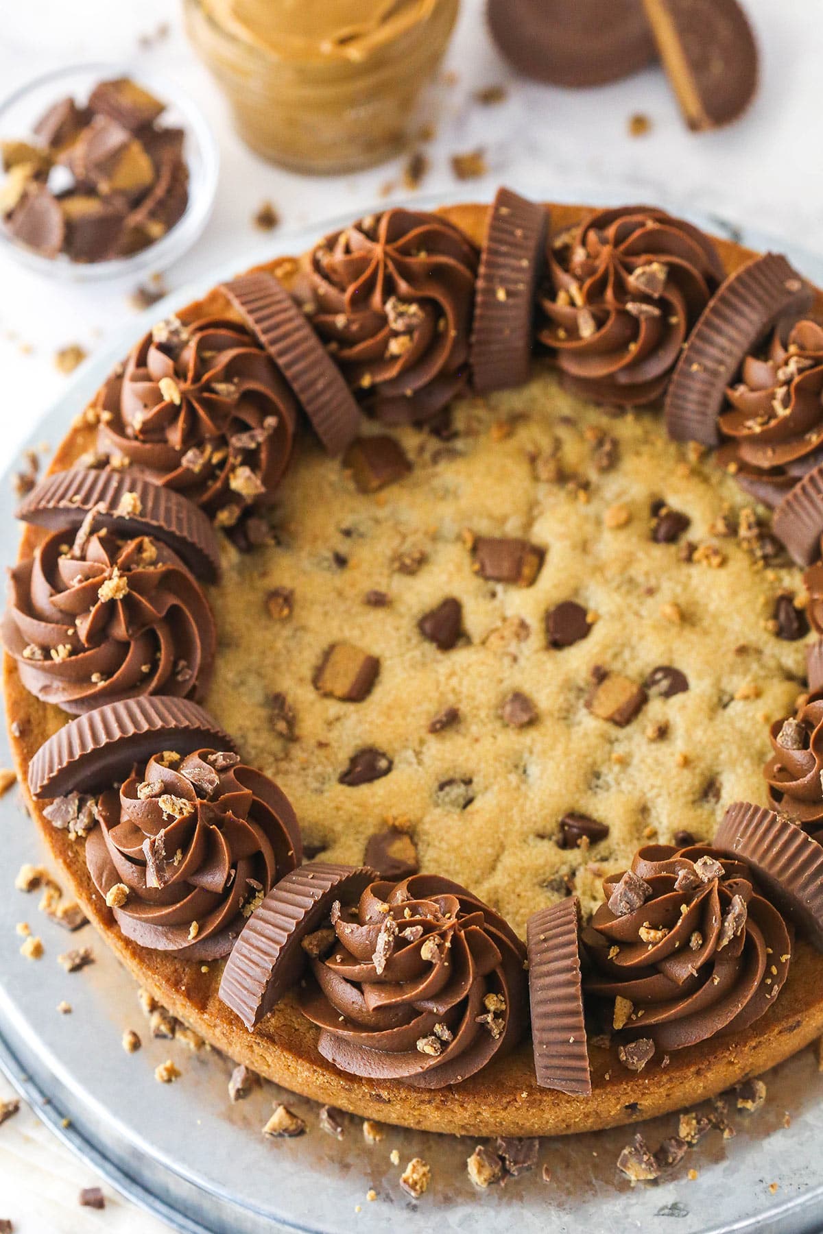 Reese's peanut butter cookie cake on a serving plate.