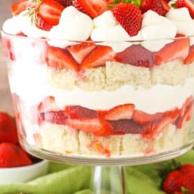 Side view of a full Strawberry Shortcake Trifle in a glass trifle dish