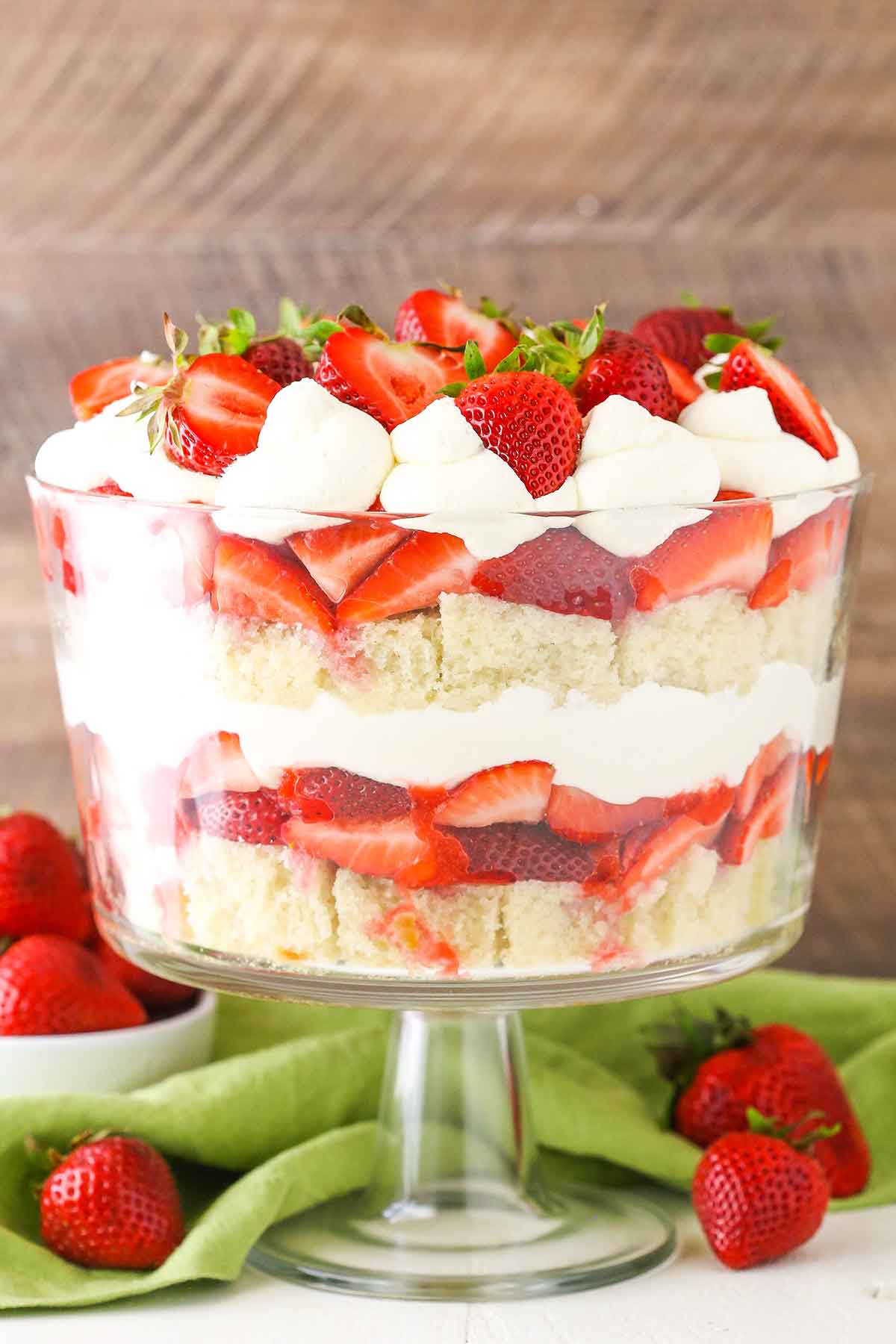 Side view of a full Strawberry Shortcake Trifle in a glass trifle dish