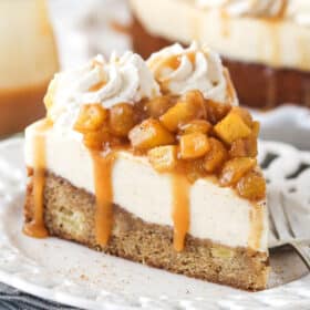 A slice of Caramel Apple Blondie Cheesecake on a small white plate.