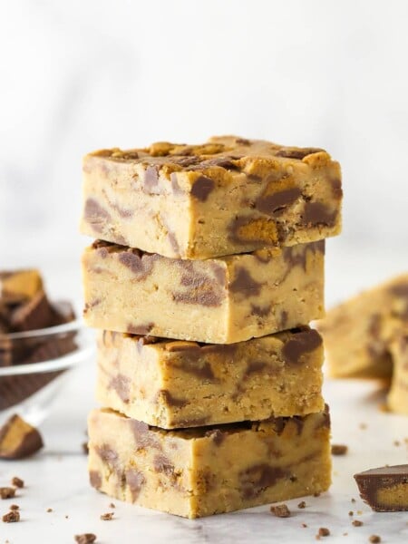A stack of 4 pieces of Reese's peanut butter fudge