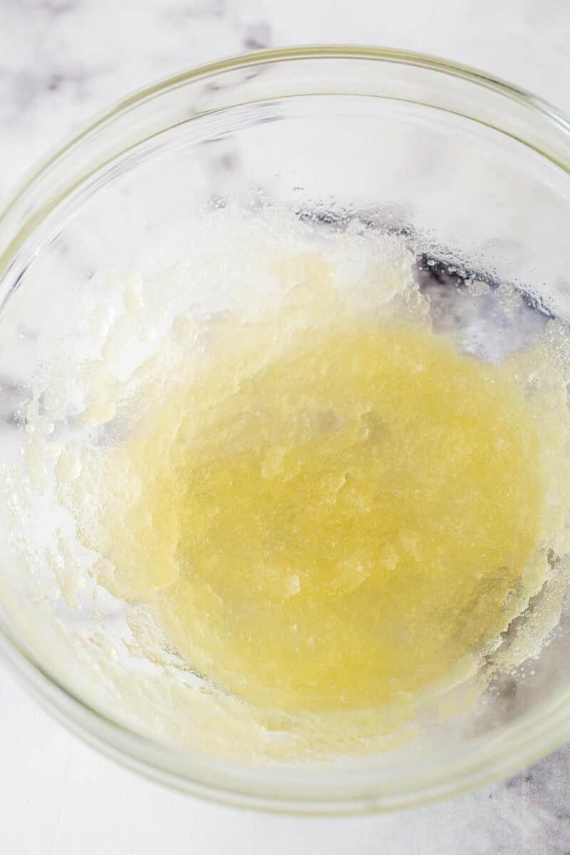 Bloomed gelatin in a clear mixing bowl.