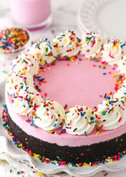 A fully decorated No Bake Strawberry Milkshake Cheesecake.