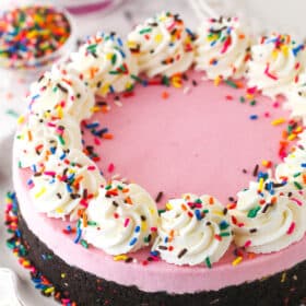 A fully decorated No Bake Strawberry Milkshake Cheesecake.