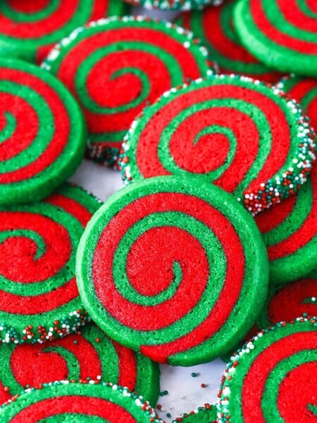 A pile of Christmas pinwheel cookies on a plate
