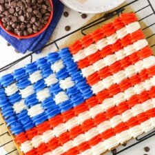 Overhead view of a full Flag Chocolate Chip Cookie Cake on a cooling rack