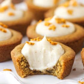 Close up of a Gingerbread Cheesecake Cookie Cup with a bite removed to show interior.