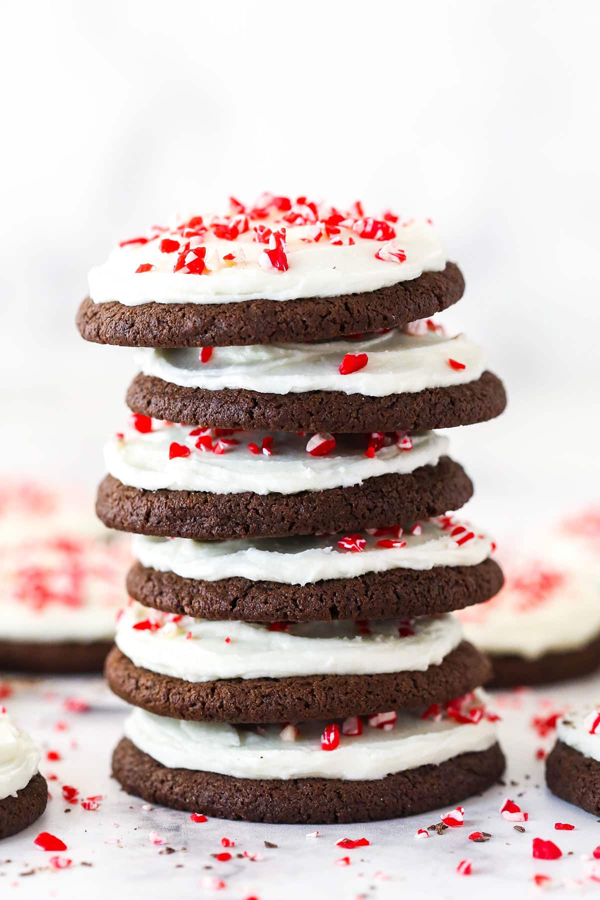 A tall stack of Peppermint Frosted Chocolate Cookies.
