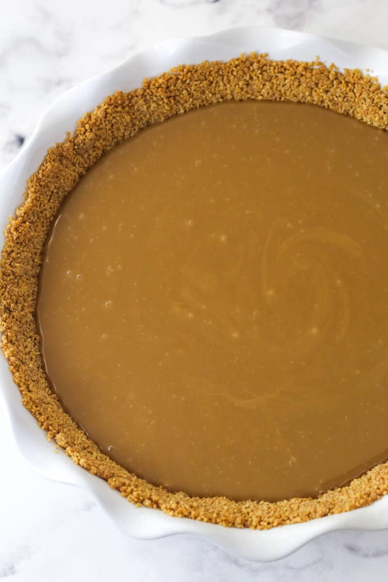 Banoffee Pie is an irresistible dessert made with a graham cracker crust, toffee filling, banana slices, and whipped cream. Toffee filling added to graham cracker pie crust