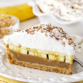A slice of banoffee pie on a white plate
