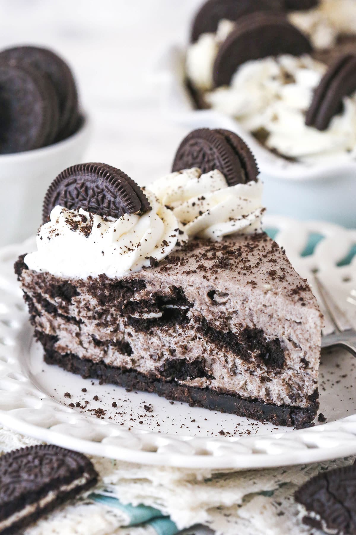 A slice of Oreo pie on a white plate