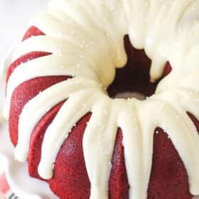 Overhead view of a red velvet bundt cake with cream cheese icing
