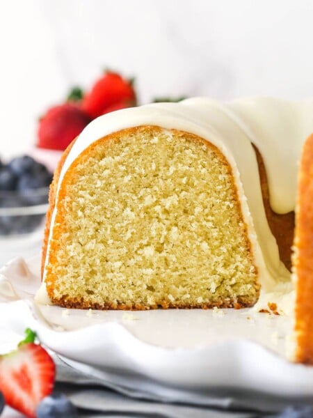 Vanilla bundt cake with a slice removed to show the inside