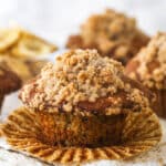 A Banana muffin with streusel topping, unwrapped and ready to enjoy.