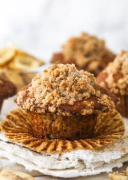 A Banana muffin with streusel topping, unwrapped and ready to enjoy.