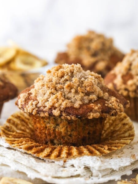 A Banana muffin with streusel topping, unwrapped and ready to enjoy.