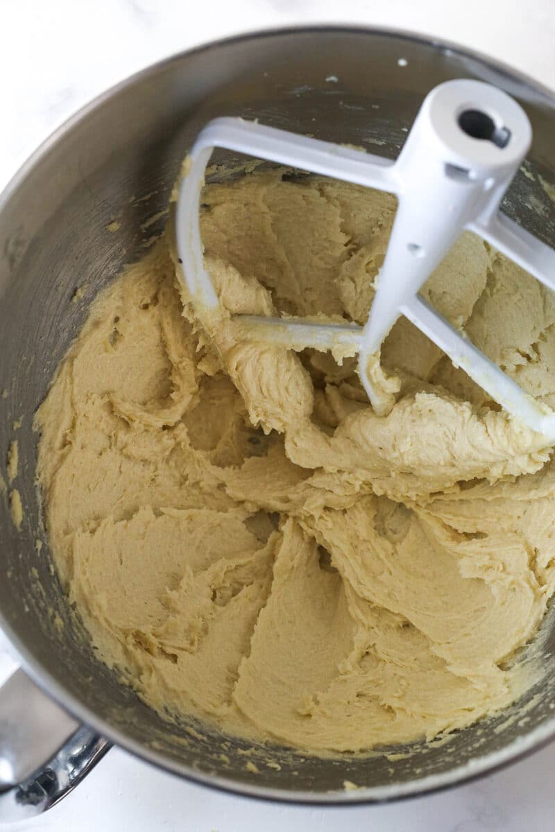 Creaming together the butter and brown sugar for M&M cookies.