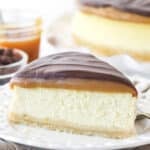 A slice of millionaire cheesecake on a plate.