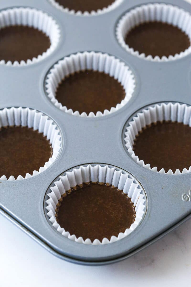 These Oreo Cupcakes are the answer to your Oreo craving! Creamy, Oreo-packed vanilla buttercream sits atop super moist chocolate cupcakes. Filling cupcake liners halfway with chocolate cupcake batter.