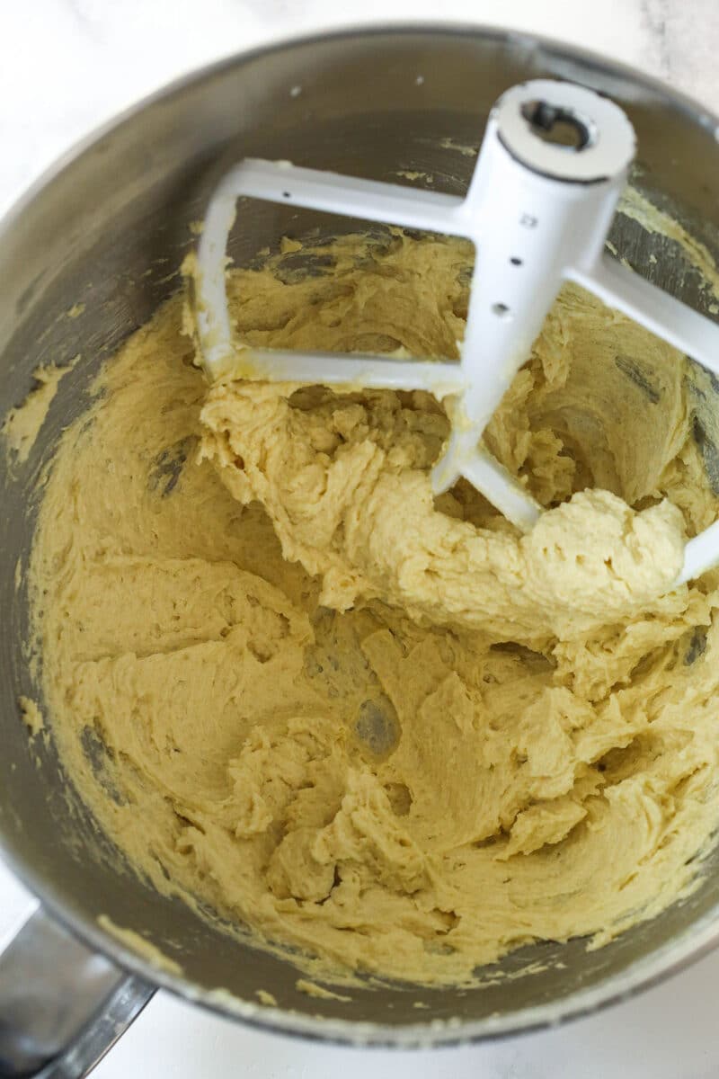 Mixing egg and vanilla into creamed butter and sugar mixture