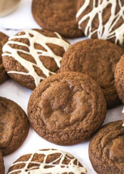 Baileys Chocolate Cookies laid out on a marble background, some with glaze and some without it.