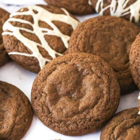 Baileys Chocolate Cookies laid out on a marble background, some with glaze and some without it.